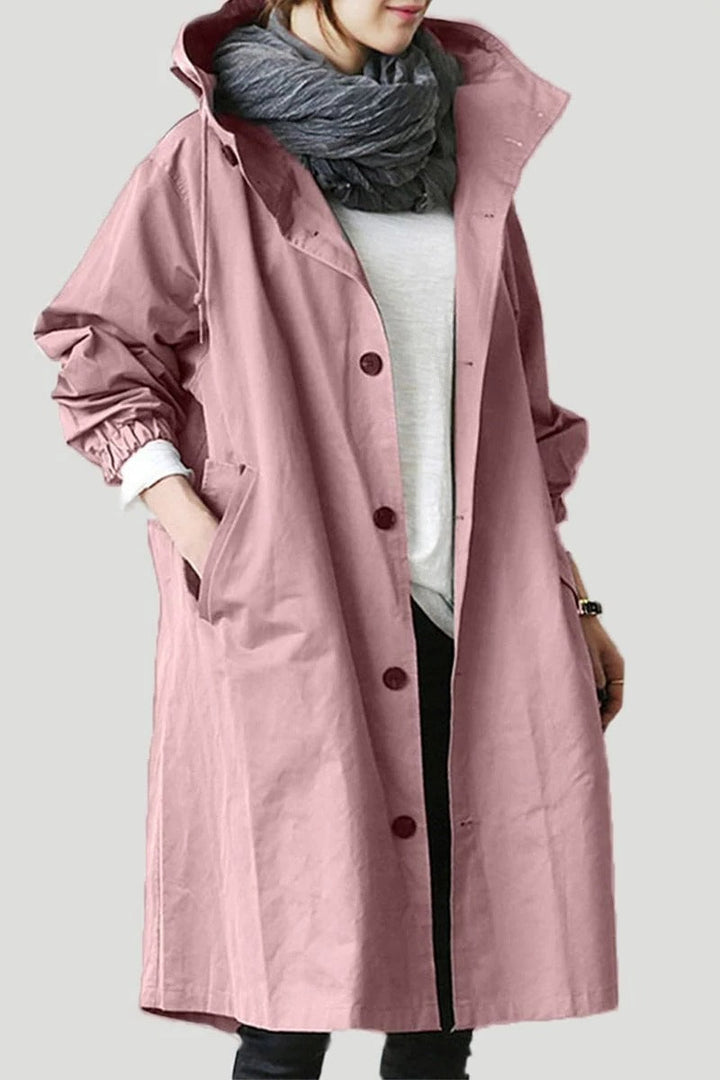 Women's hooded waterproof trench coat, front view. Adjustable hood, belted waist, available in various colors.