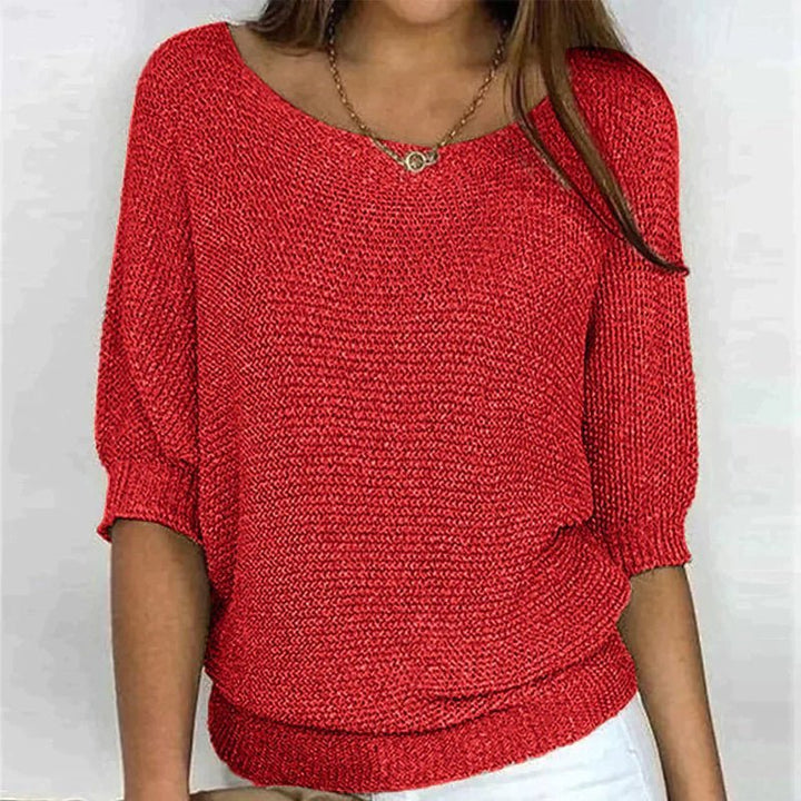 Women's loose knit pullover with half sleeves, wide neckline, textured knit, relaxed fit, ideal for casual elegance.