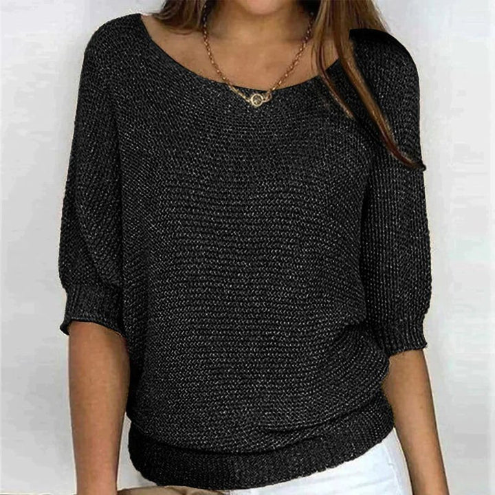 Women's loose knit pullover with half sleeves, wide neckline, textured knit, relaxed fit, ideal for casual elegance.
