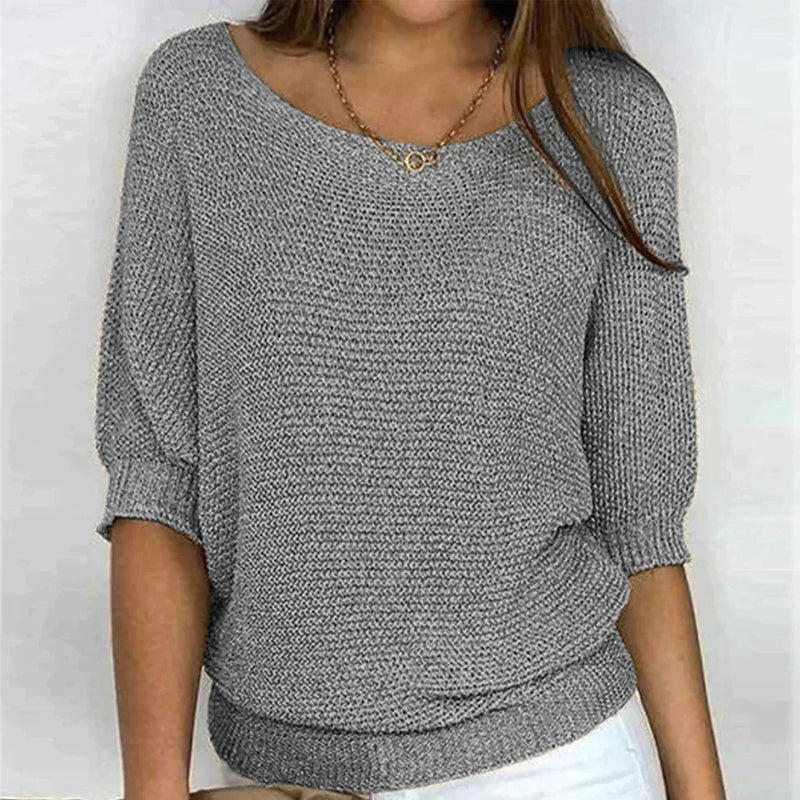 Women's loose knit pullover with half sleeves, wide neckline, textured knit, relaxed fit, ideal for casual elegance.