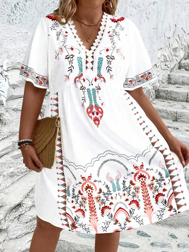 Women's plus size midi dress with boho lace, featuring intricate details and flowing silhouette, front view.