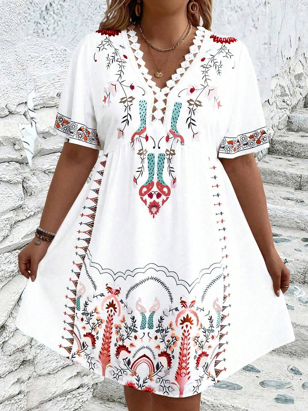 Women's plus size midi dress with boho lace, featuring intricate details and flowing silhouette, front view.
