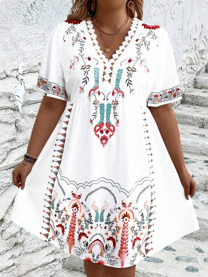 Women's plus size midi dress with boho lace, featuring intricate details and flowing silhouette, front view.