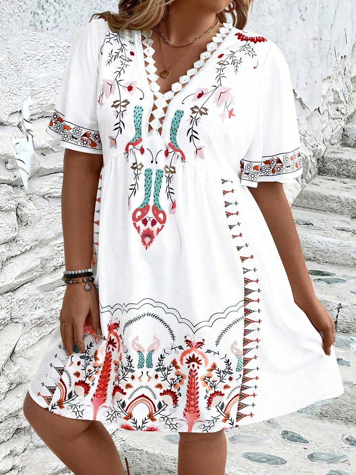 Women's plus size midi dress with boho lace, featuring intricate details and flowing silhouette, front view.