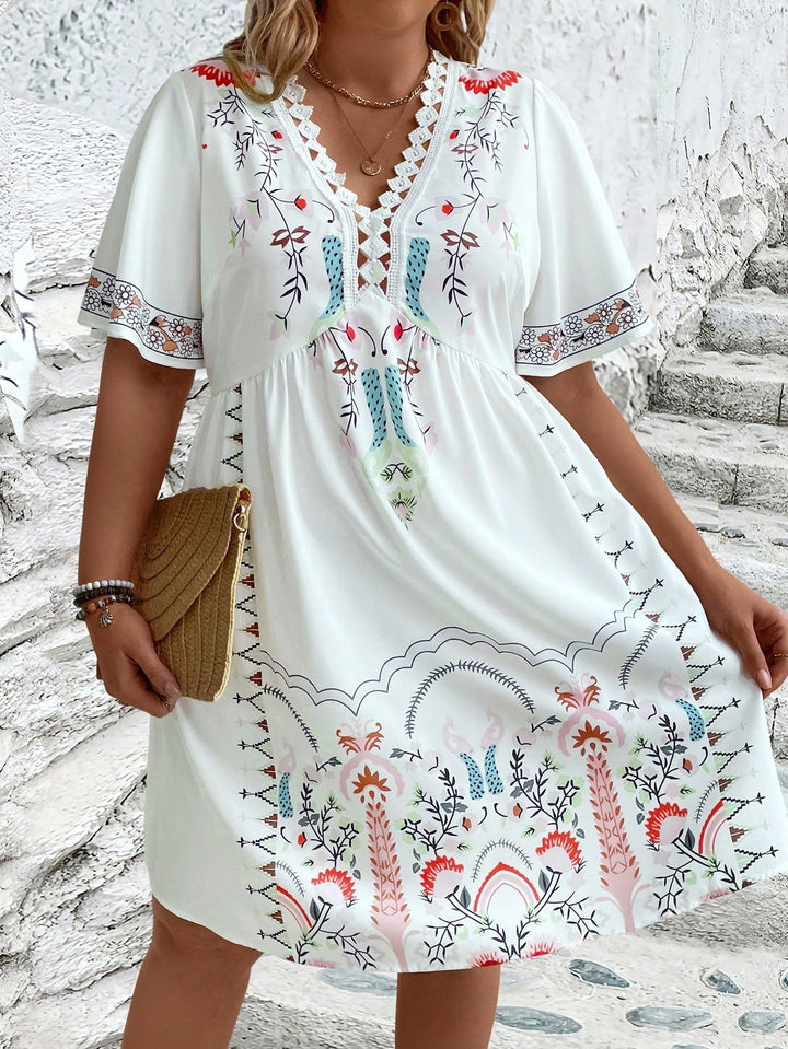 Women's plus size midi dress with boho lace, featuring intricate details and flowing silhouette, front view.