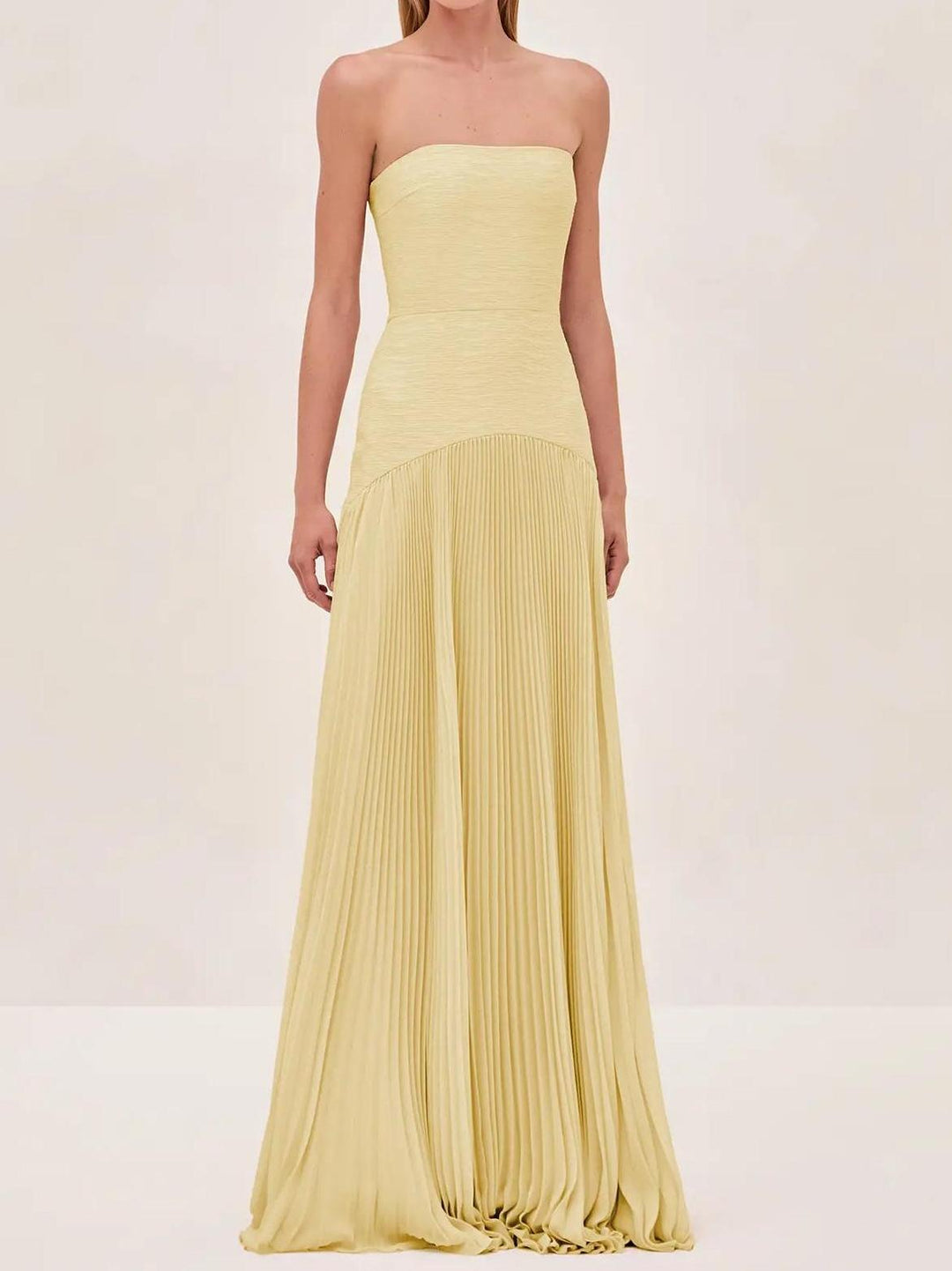 "Women's strapless pleated maxi dress in green and yellow, front view; elegant evening wear with a pleated skirt."