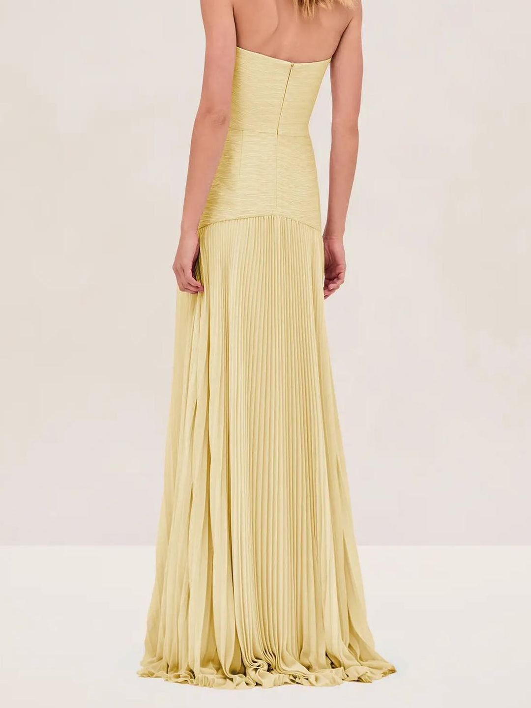 "Women's strapless pleated maxi dress in green and yellow, front view; elegant evening wear with a pleated skirt."