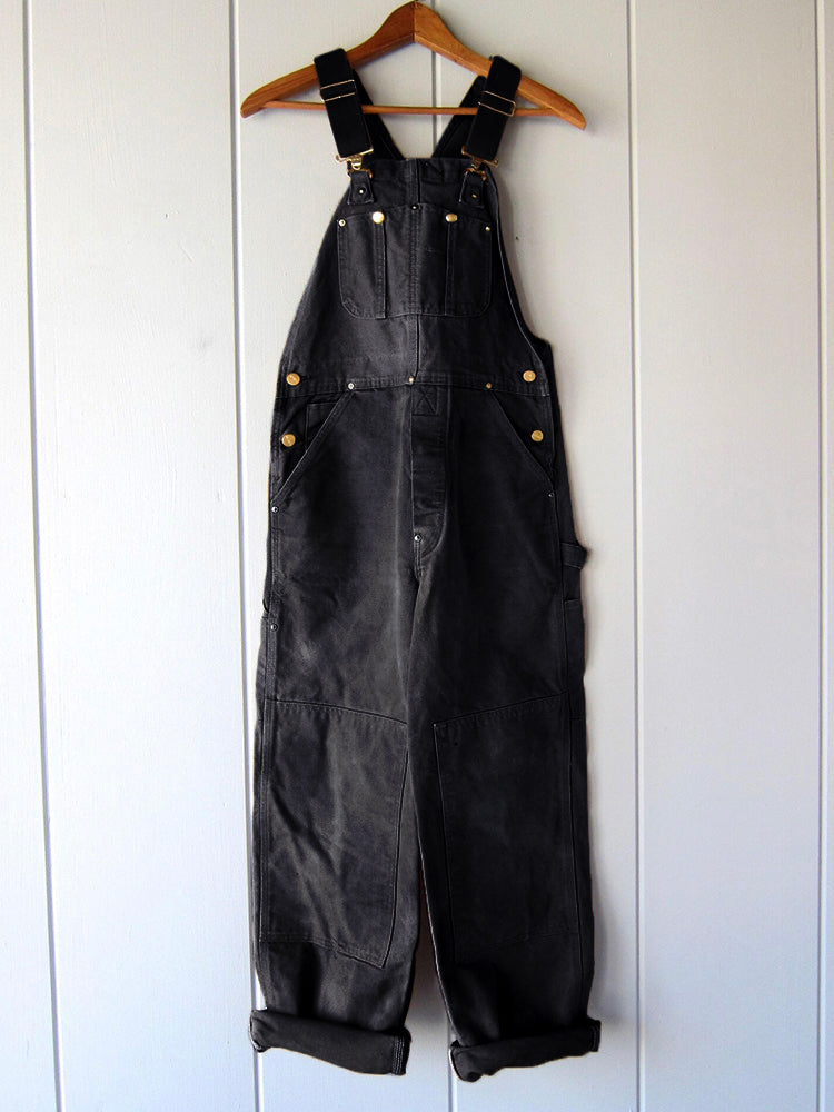 Women's utility bib overalls, adjustable straps, multi-patch pockets, wide-leg fit, durable, stylish canvas workwear.
