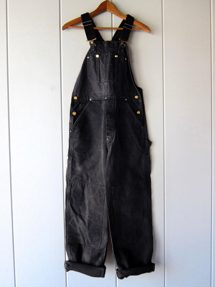 Women's utility bib overalls, adjustable straps, multi-patch pockets, wide-leg fit, durable, stylish canvas workwear.