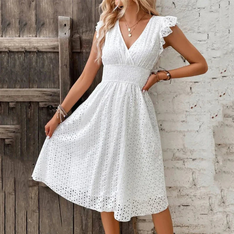 "Women's V-Neck eyelet summer dress with smocked waist, ruffled sleeves, and knee-length A-line in light fabric."