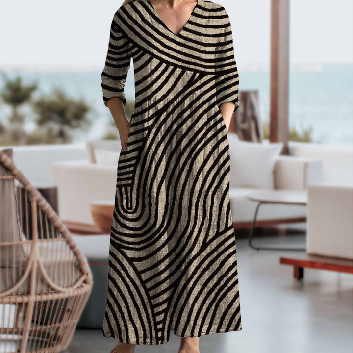 "Women's vintage stripe maxi dress with pockets, featuring a retro stripe pattern and relaxed fit, perfect for all occasions.