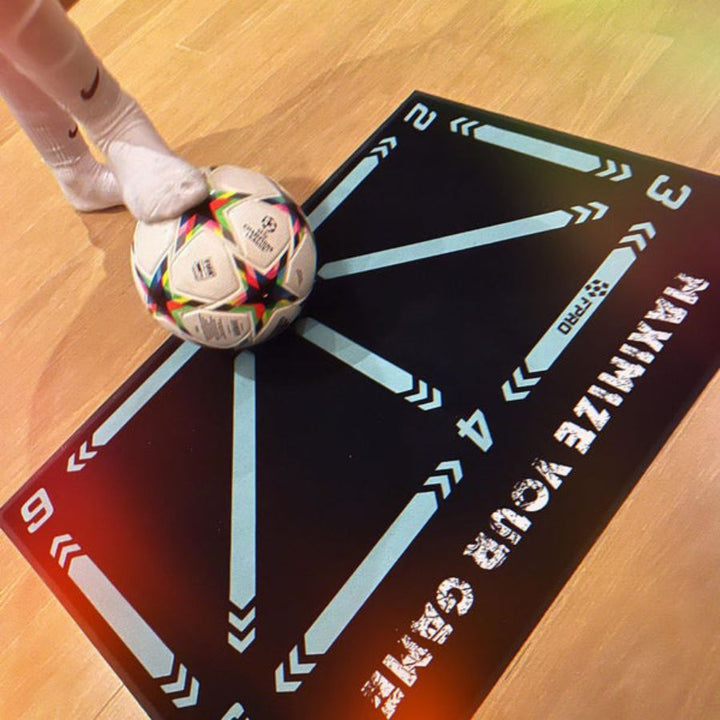Young athlete using a fun football training mat for dribbling and coordination drills at home.