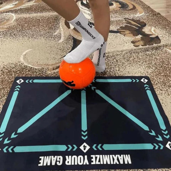 Durable youth football training mat with marked zones for skill development & effective home practice.